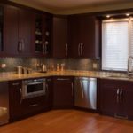 : cherry kitchen cabinets with backsplash
