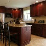 : cherry kitchen cabinets with hardwood floors