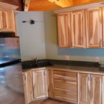 : hickory cabinets with dark floors